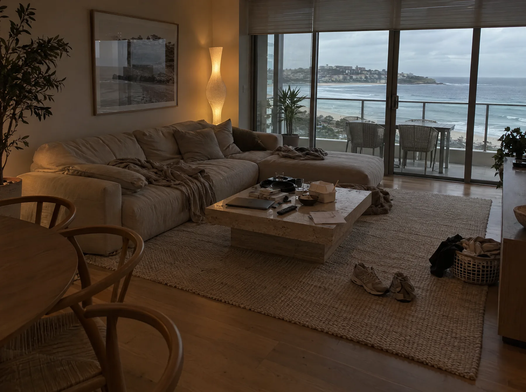Before: a Bondi apartment living room with takeaway, a laptop, shoes and laundry out
