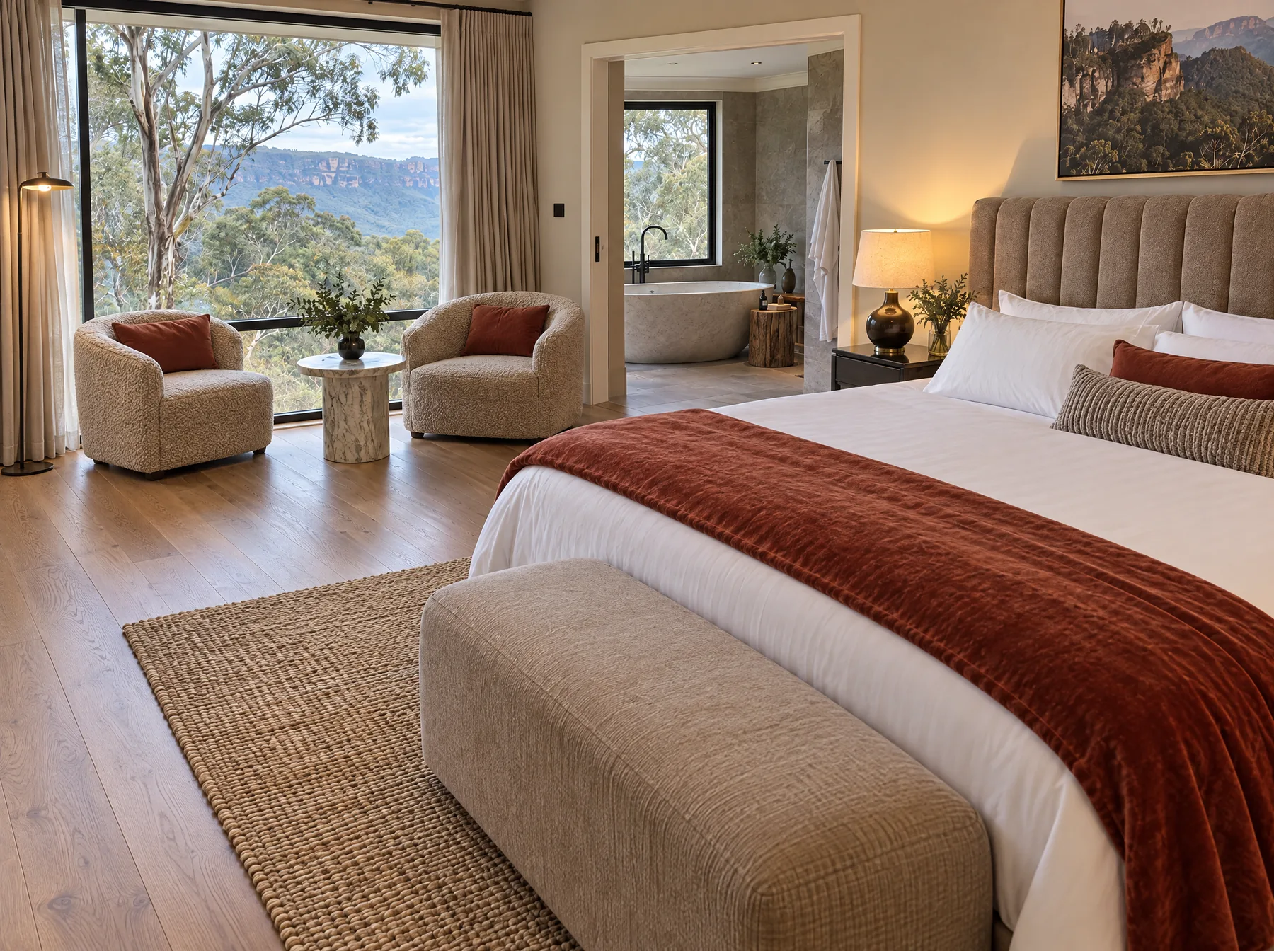 After: the same suite with the bed made, the velvet throw folded and the valley view